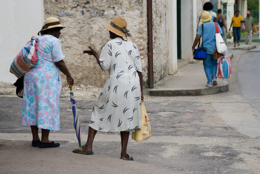 Barbados Holetown St Thomas parish west coast two Bajan ladies typically dressed chat on a street corner retouched version