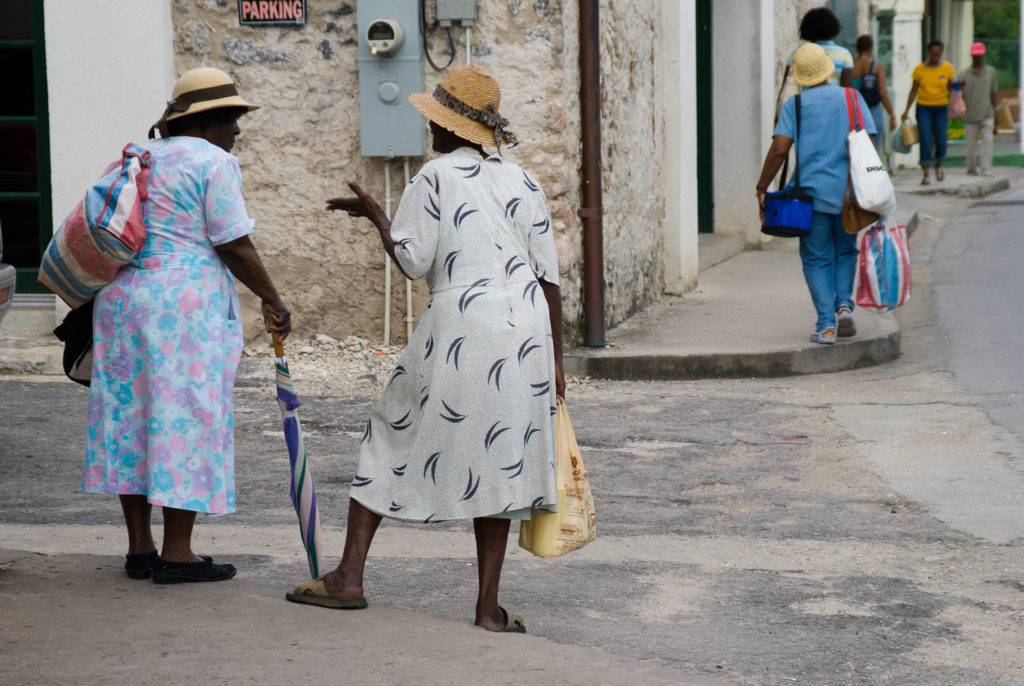 Barbados Holetown St Thomas parish west coast two Bajan ladies typically dressed chat on a street corner